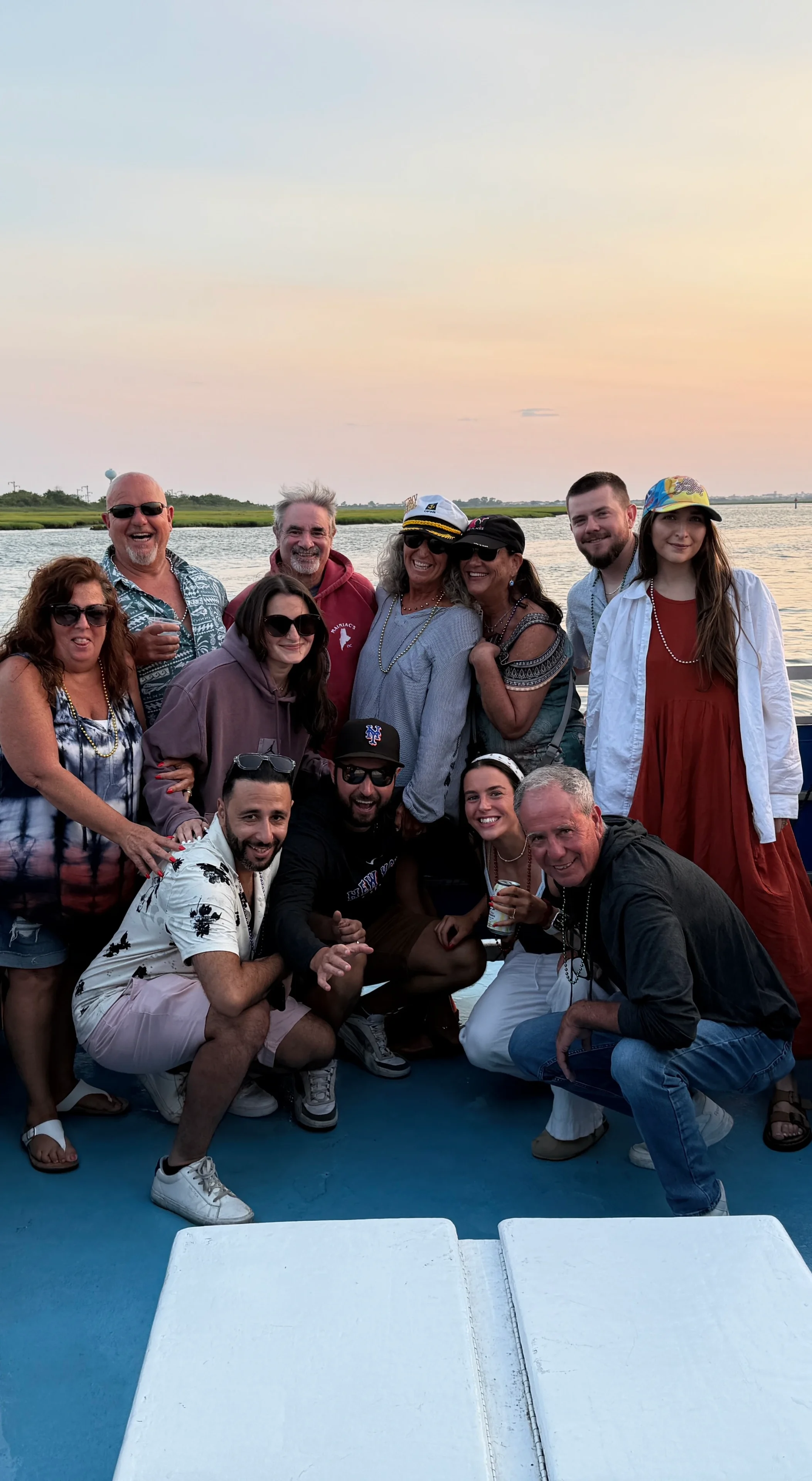 Happy group celebrating by the water
