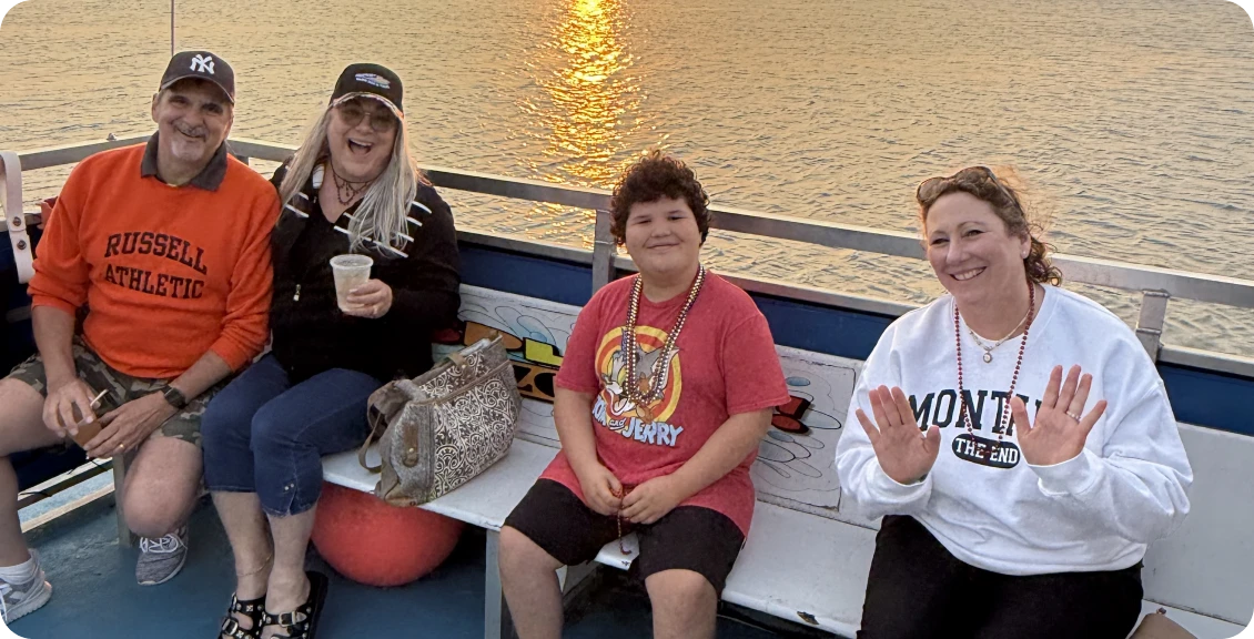 Friends on a boat at sunset