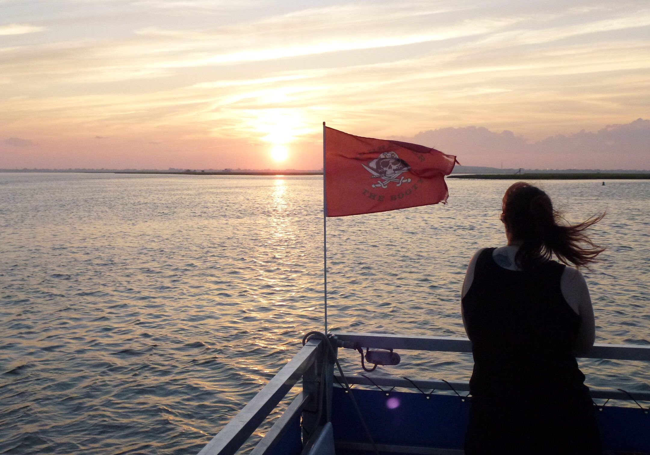 Red flag waving on boat deck
