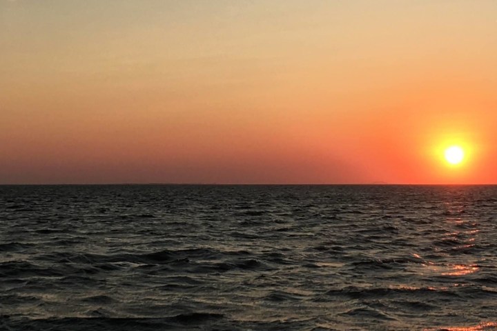 a sunset over a body of water